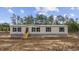 Inviting exterior view of the single story home, complete with a wood staircase and stone skirting at 108 Forman Way, Aynor, SC 29511