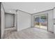 Open living area with wood-look flooring and sliding glass doors to outdoor deck at 108 Forman Way, Aynor, SC 29511