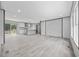 Spacious living area featuring wood-look floors, neutral walls, and an open floor plan with kitchen views at 108 Forman Way, Aynor, SC 29511