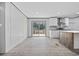 Modern open floorplan with an adjacent kitchen and sliding glass doors at 108 Forman Way, Aynor, SC 29511