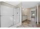 A bathroom features a shower area, a vanity, and wood-look floors at 109 Forman Way, Aynor, SC 29511