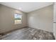 This bedroom features neutral walls, updated flooring and a sunny window at 109 Forman Way, Aynor, SC 29511
