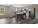 Well-equipped kitchen featuring stainless steel appliances and a stylish central island with pendant lighting at 109 Forman Way, Aynor, SC 29511
