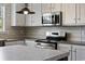 A kitchen features stainless steel appliances and light wood colored cabinets and countertops at 109 Forman Way, Aynor, SC 29511