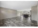 An open-concept living and dining area features wood-look floors and neutral-colored walls at 109 Forman Way, Aynor, SC 29511