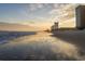 Beautiful coastal scene with waves meeting the sandy shore near a condo building at sunset at 119 Westfield Circle, Conway, SC 29526