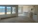 Bright interior with large windows and a lake view, featuring pristine white walls and cabinets at 119 Westfield Circle, Conway, SC 29526