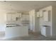 Bright kitchen featuring white cabinets, ample counter space, and modern fixtures awaiting completion at 119 Westfield Circle, Conway, SC 29526
