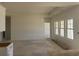 Spacious living room with large windows and bright natural light in a new construction home at 119 Westfield Circle, Conway, SC 29526