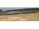 Scenic view of a well-maintained pond surrounded by lush greenery, creating a serene and peaceful environment at 119 Westfield Circle, Conway, SC 29526