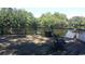 Scenic river view with benches on a wooden deck and lush trees in the background for tranquil enjoyment at 119 Westfield Circle, Conway, SC 29526