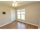 Bedroom with hardwood flooring, ceiling fan, closet and natural light at 123 Retreat Pl., Little River, SC 29566