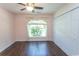 Bedroom with hardwood flooring, closet, and a window at 123 Retreat Pl., Little River, SC 29566