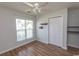 Bedroom with hardwood flooring, closet, ceiling fan and window at 123 Retreat Pl., Little River, SC 29566
