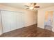 Spacious bedroom with hardwood floors, closet, and neutral paint, offering a versatile space at 123 Retreat Pl., Little River, SC 29566