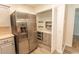 Kitchen with stainless steel refrigerator and pantry at 123 Retreat Pl., Little River, SC 29566