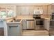Kitchen featuring stainless steel appliances and gray cabinetry at 123 Retreat Pl., Little River, SC 29566