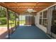 Enclosed patio featuring a ceiling fan and views of the landscaped backyard at 123 Retreat Pl., Little River, SC 29566