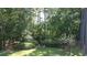 Beautiful lush backyard with mature trees and landscaping provides a private, serene retreat at 1307 Carolina Wren Ln., Murrells Inlet, SC 29576