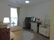 Bright bedroom featuring a window, desk, chair, and a neutral color scheme for rest and focus at 1307 Carolina Wren Ln., Murrells Inlet, SC 29576