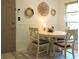 Cozy dining area features decor, natural light, and seating for four at 1307 Carolina Wren Ln., Murrells Inlet, SC 29576