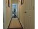 Inviting hallway with hardwood floors and recessed lighting creates a seamless transition between rooms at 1307 Carolina Wren Ln., Murrells Inlet, SC 29576