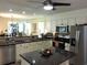Bright kitchen features granite countertops, island, stainless steel appliances, and ample cabinet storage at 1307 Carolina Wren Ln., Murrells Inlet, SC 29576