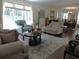 Open-concept living room with stylish decor, natural light, and hardwood flooring at 1307 Carolina Wren Ln., Murrells Inlet, SC 29576