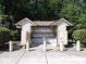 A charming mailbox structure adorned with colorful decorations and surrounded by lush greenery on a sunny day at 1307 Carolina Wren Ln., Murrells Inlet, SC 29576