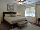 Well-lit main bedroom features a large bed and a neutral color scheme for a relaxing atmosphere at 1307 Carolina Wren Ln., Murrells Inlet, SC 29576
