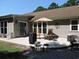 This home's patio features an open space with chairs and an umbrella to enjoy the outdoors at 1307 Carolina Wren Ln., Murrells Inlet, SC 29576