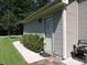Side exterior entry door features vinyl siding, garden, and walkway at 1307 Carolina Wren Ln., Murrells Inlet, SC 29576