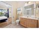 Bright bathroom showcasing a single sink vanity, toilet, and walk-in shower at 139 Avian Dr. # 6-201, Pawleys Island, SC 29585