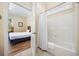 Bathroom view looking into bedroom featuring a walk in shower with curtain at 139 Avian Dr. # 6-201, Pawleys Island, SC 29585