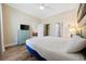Bright bedroom with wood floors, ceiling fan and access to ensuite bathroom at 139 Avian Dr. # 6-201, Pawleys Island, SC 29585