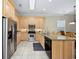 Well-lit kitchen with granite countertops, stainless steel appliances, and ample cabinet space at 139 Avian Dr. # 6-201, Pawleys Island, SC 29585