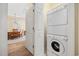 Convenient laundry area with stacked washer and dryer near dining room at 139 Avian Dr. # 6-201, Pawleys Island, SC 29585