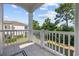 View from porch overlooking trees and community, inviting relaxation at 139 Avian Dr. # 6-201, Pawleys Island, SC 29585