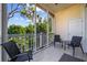 Screened porch with tiled floor and comfortable seating overlooking lush greenery at 139 Avian Dr. # 6-201, Pawleys Island, SC 29585