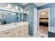 Bathroom featuring hanging lights over vanity and doorway leading to bedroom at 140 Pixie Dust Ct., Myrtle Beach, SC 29588