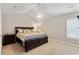Comfortable primary bedroom with ceiling fan, carpeted floors and vaulted ceiling provides plenty of space at 140 Pixie Dust Ct., Myrtle Beach, SC 29588
