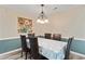 Formal dining room features a chandelier, seating for six and wainscotting on the lower portion of the walls at 140 Pixie Dust Ct., Myrtle Beach, SC 29588