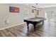 Spacious game room with pool table, natural light and backyard access through french doors at 140 Pixie Dust Ct., Myrtle Beach, SC 29588