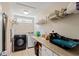 Well-equipped laundry room with modern appliances and ample storage space and a heat press machine at 140 Pixie Dust Ct., Myrtle Beach, SC 29588