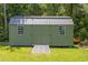 Exterior shot of the backyard shed with a metal roof and double doors at 140 Pixie Dust Ct., Myrtle Beach, SC 29588