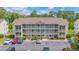 Attractive condo building with three stories of units and balconies, surrounded by well-kept landscaping at 1450 St. George Ln. # E, Myrtle Beach, SC 29588