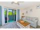 Relaxing living room with a sliding glass door to the balcony and a comfortable sofa with decorative pillows at 1450 St. George Ln. # E, Myrtle Beach, SC 29588