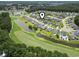 Aerial view of the community showing the location, golf course, ponds and surrounding trees at 155 Palmetto Green Dr., Longs, SC 29568