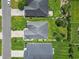 Aerial view of the property highlighting the roof, landscaping, and surrounding neighborhood at 155 Palmetto Green Dr., Longs, SC 29568