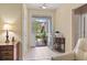 Inviting tiled foyer with a view of the outdoors through the open front door at 155 Palmetto Green Dr., Longs, SC 29568